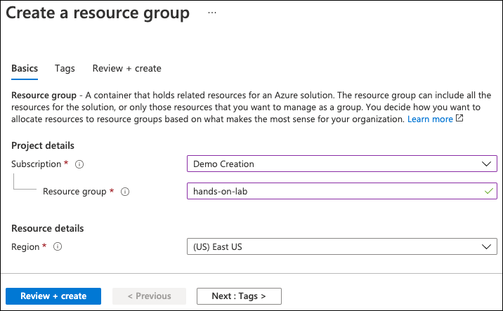 The values specified above are entered into the Create a resource group Basics tab.